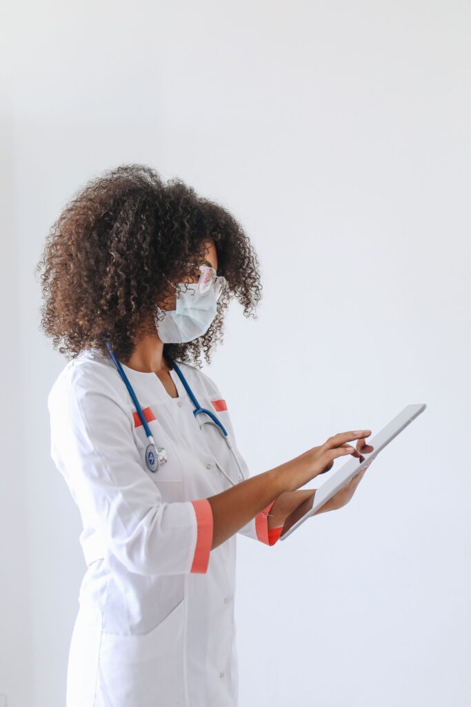 A woman healthcare doctor using her iPad
